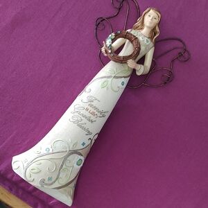 Elegant Angel Sculpture with Floral Accents